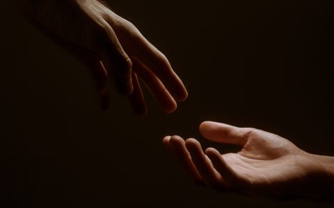grayscale photo of persons hand