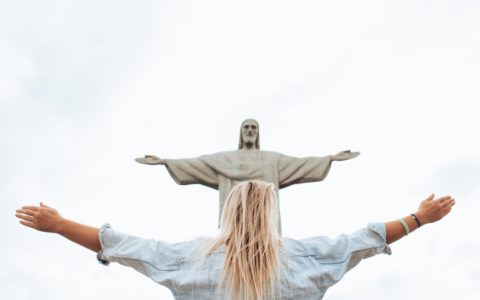 woman in white long sleeve shirt and blue denim jeans