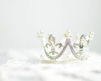 shallow photography of silver-colored crown