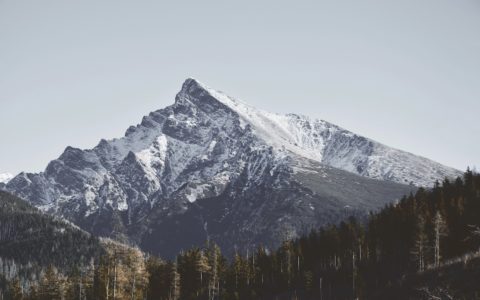 snow covered mountain during daytime