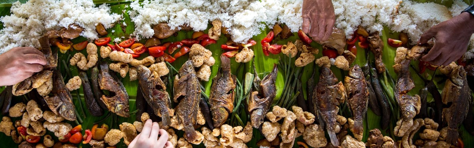 photo of people eating rice