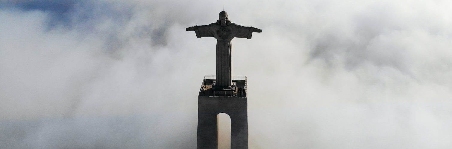 Christ Redeemer covered with clouds at daytime