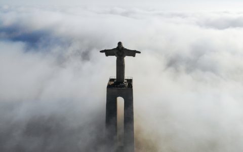Christ Redeemer covered with clouds at daytime